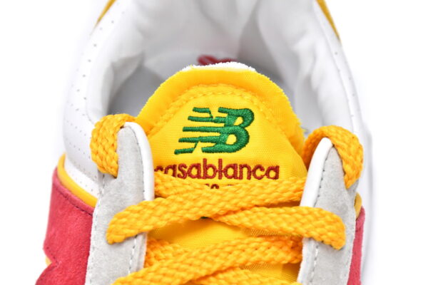 White, yellow, and red executive edition of the New Bailun XC-72 series running shoes