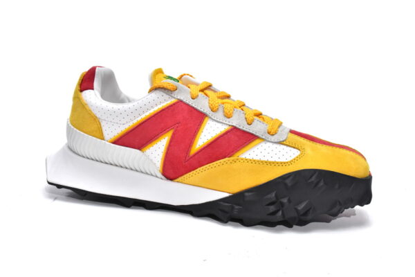 White, yellow, and red executive edition of the New Bailun XC-72 series running shoes